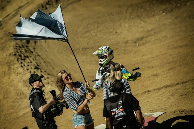 An umbrella collapses due to heavy winds while Brody Wilson waits for his run. Credit: Jörg Mitter/Red Bull Content Pool