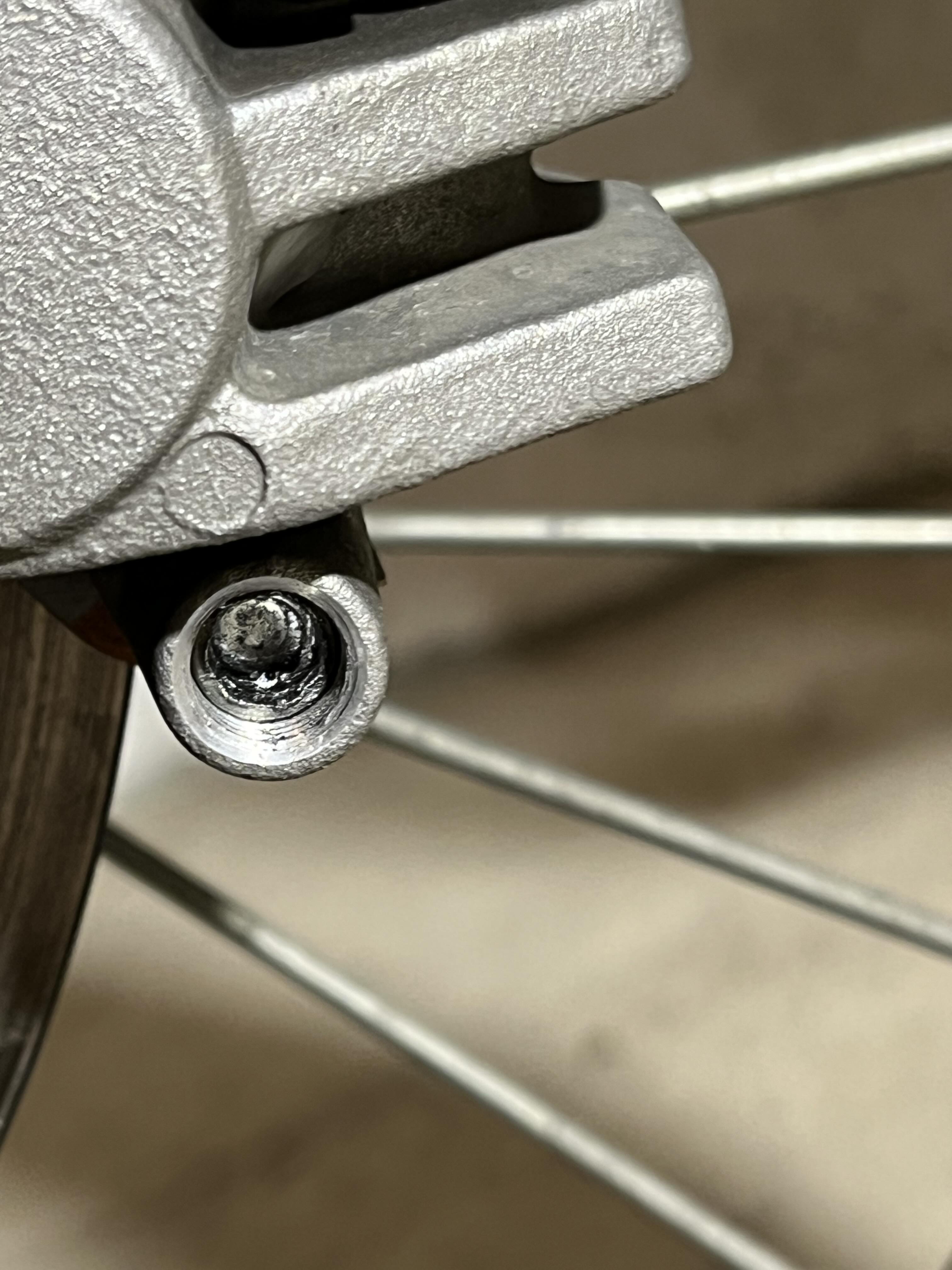 Stripped allen bolt on front brake that holds brake pads in place