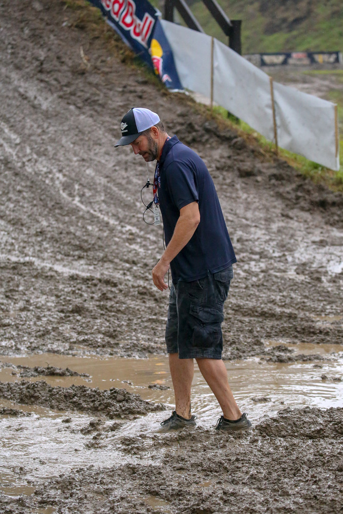 Davey Coombs, doing a little readjustment before practice to try and divert some of the standing water off the course.