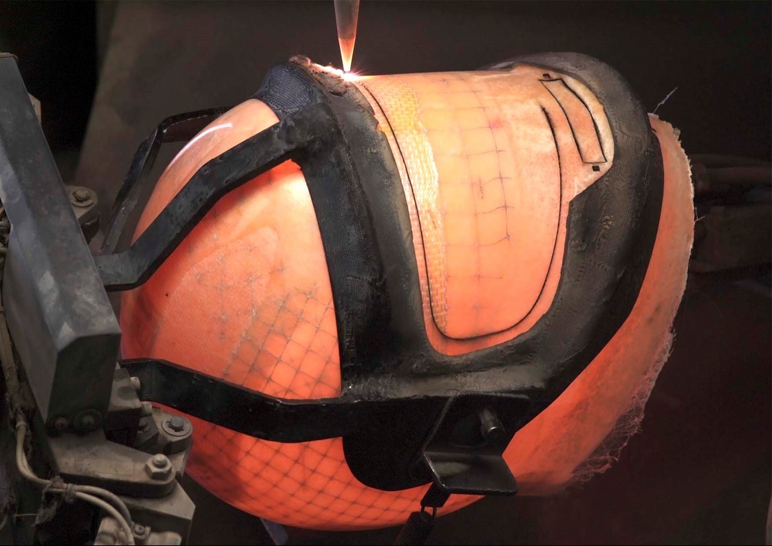 I know that I'm rough around the edges right off the bat. That's why they use this laser cutter and put me in a Hannibal Lecter mask to clean me up. Every size and style of me has its own face cage.