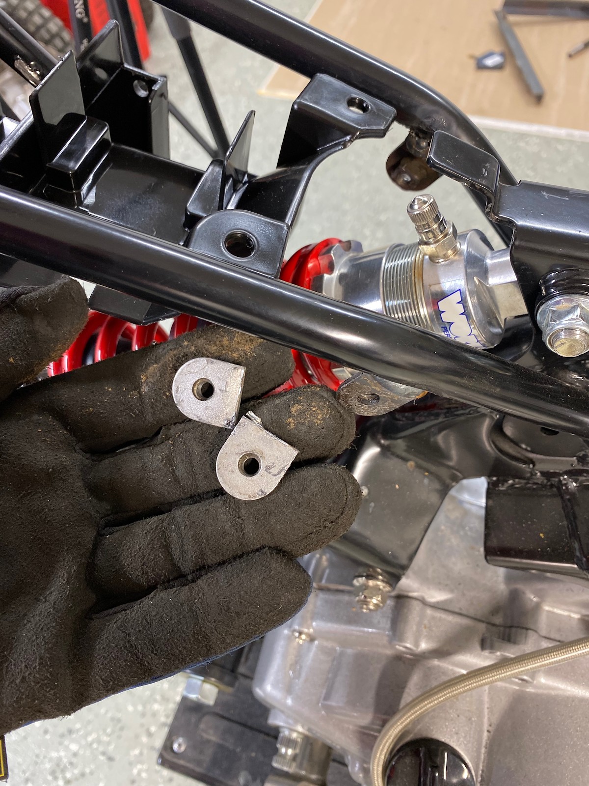 tabs that I cut off the swing arm