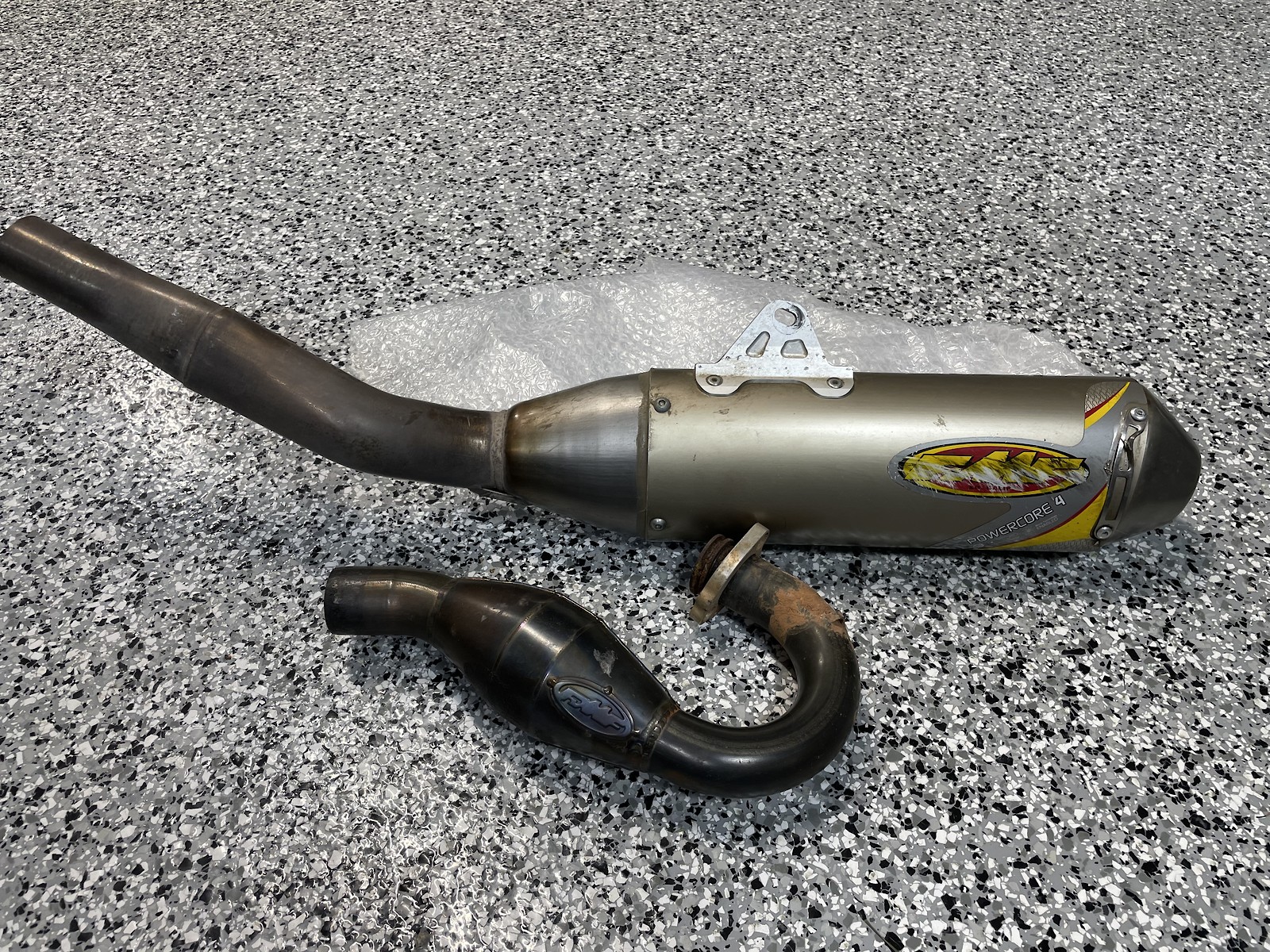 needing some clean up, new rivets, stickers, and lots of Pryme MX pad polishing on the header